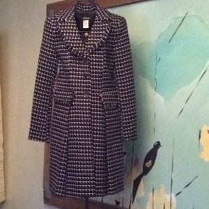 Black and White coat with fringed collar.